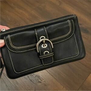 Coach Black Soho wristlet bag.